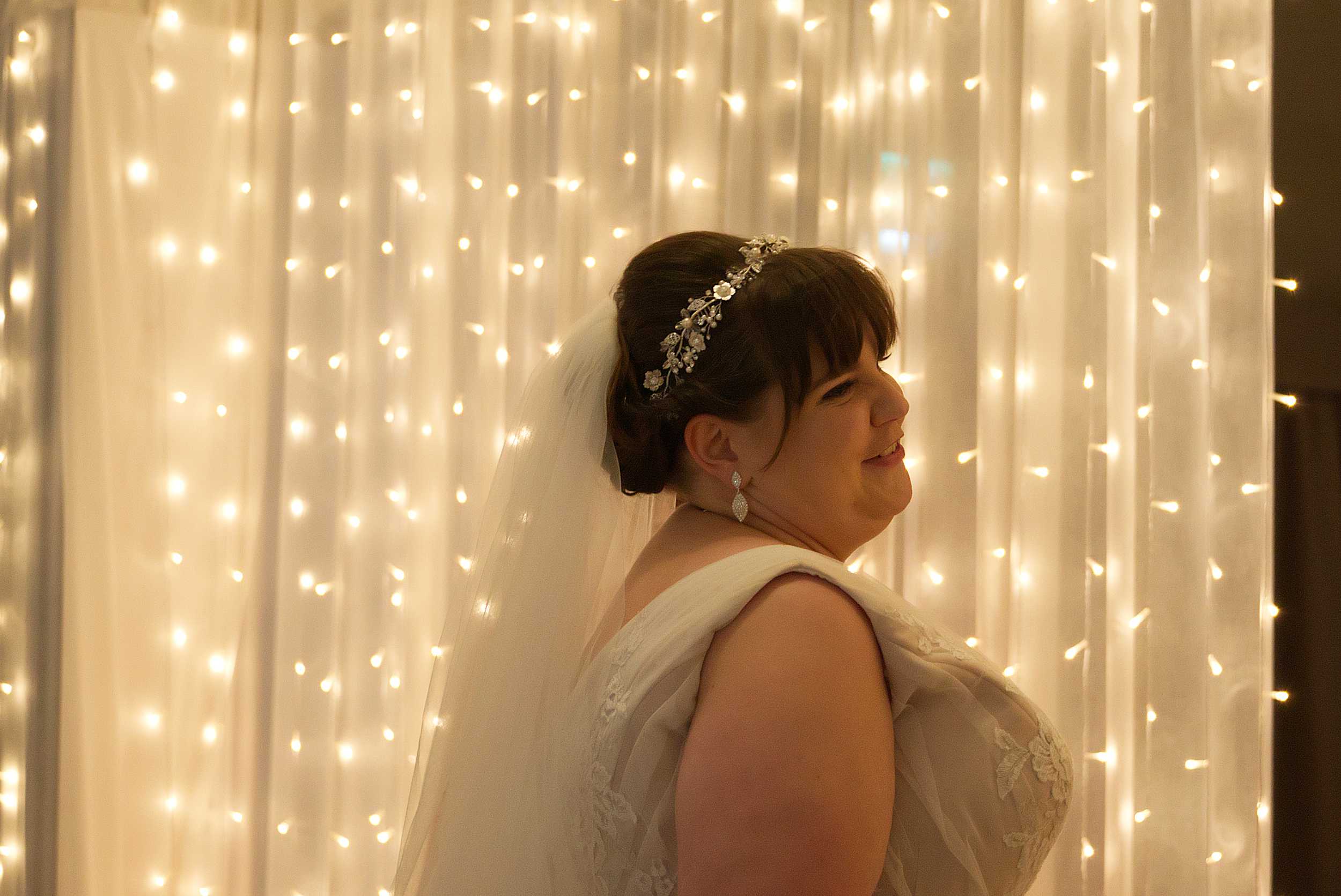 beautiful bride in front of light curtain stoke place wedding berkshire