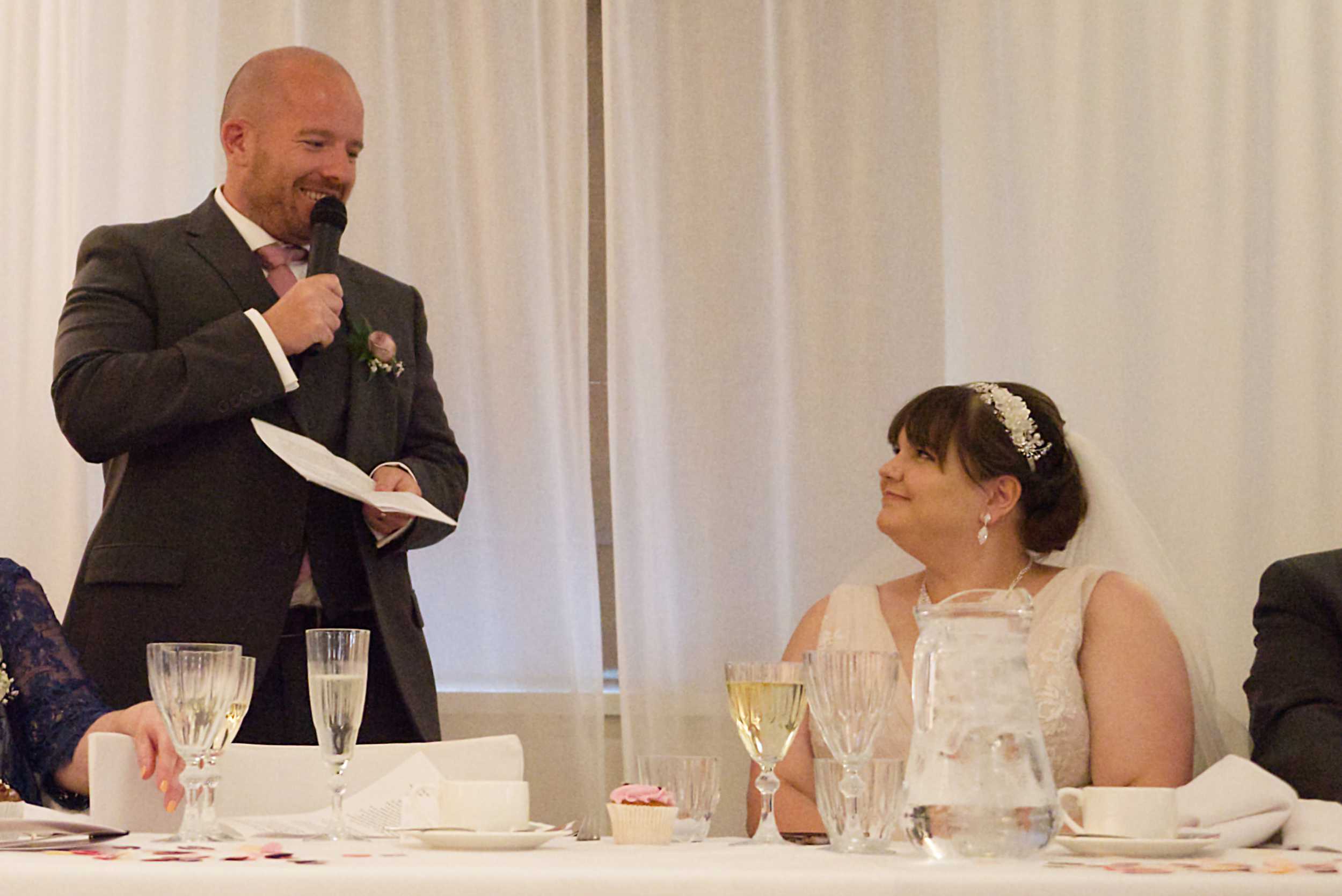 groom speech moment with bride Stoke Place wedding photographer
