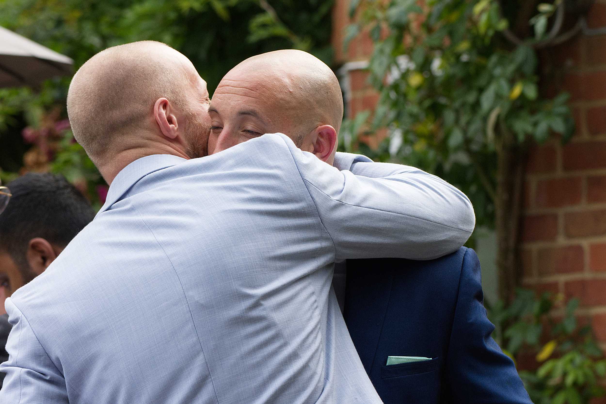 manhug for the groom natural wedding photography stoke place