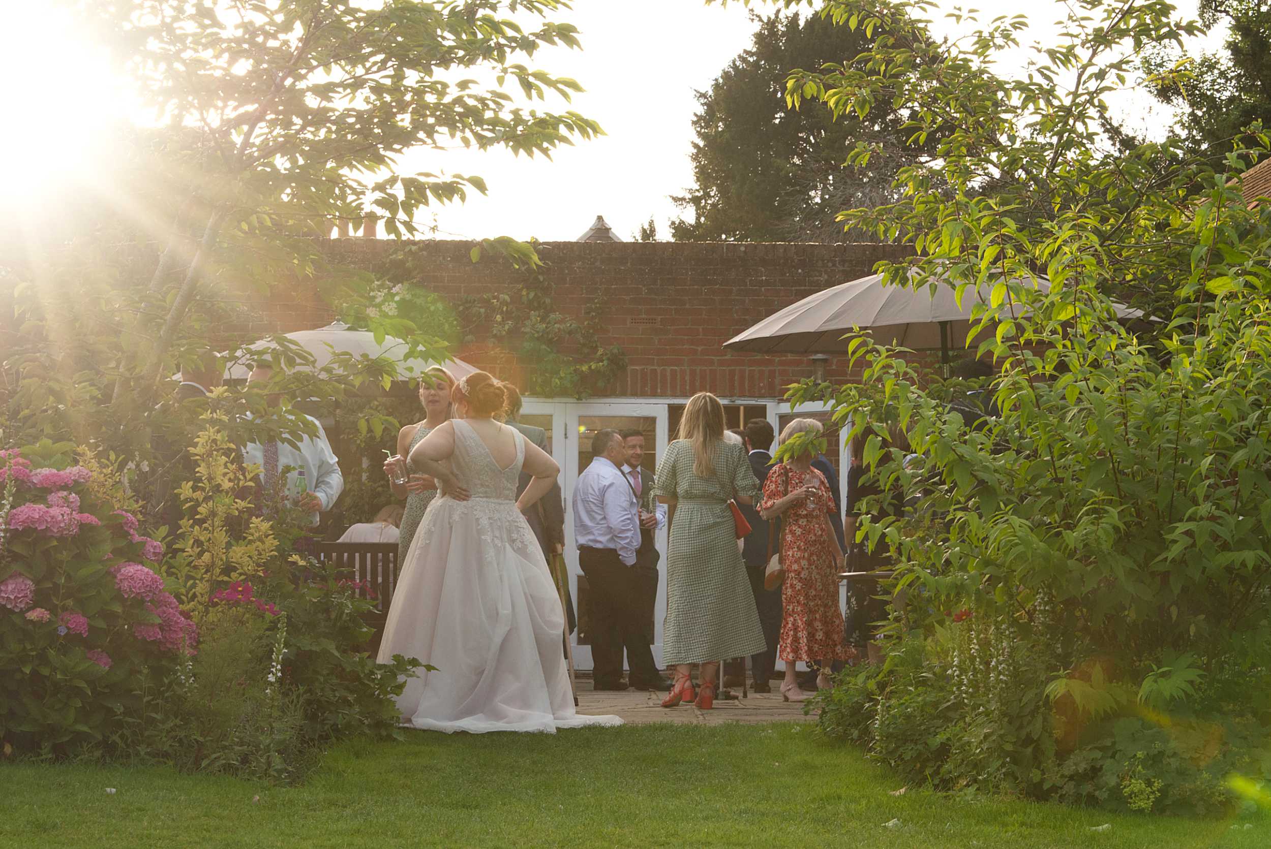 Logo elements ARROWS copyright Nadina Bee Artful low light wedding photography of sunset wedding at Stoke Place Buckinghamshire and whether you should hire a photographer who has worked at your venue before