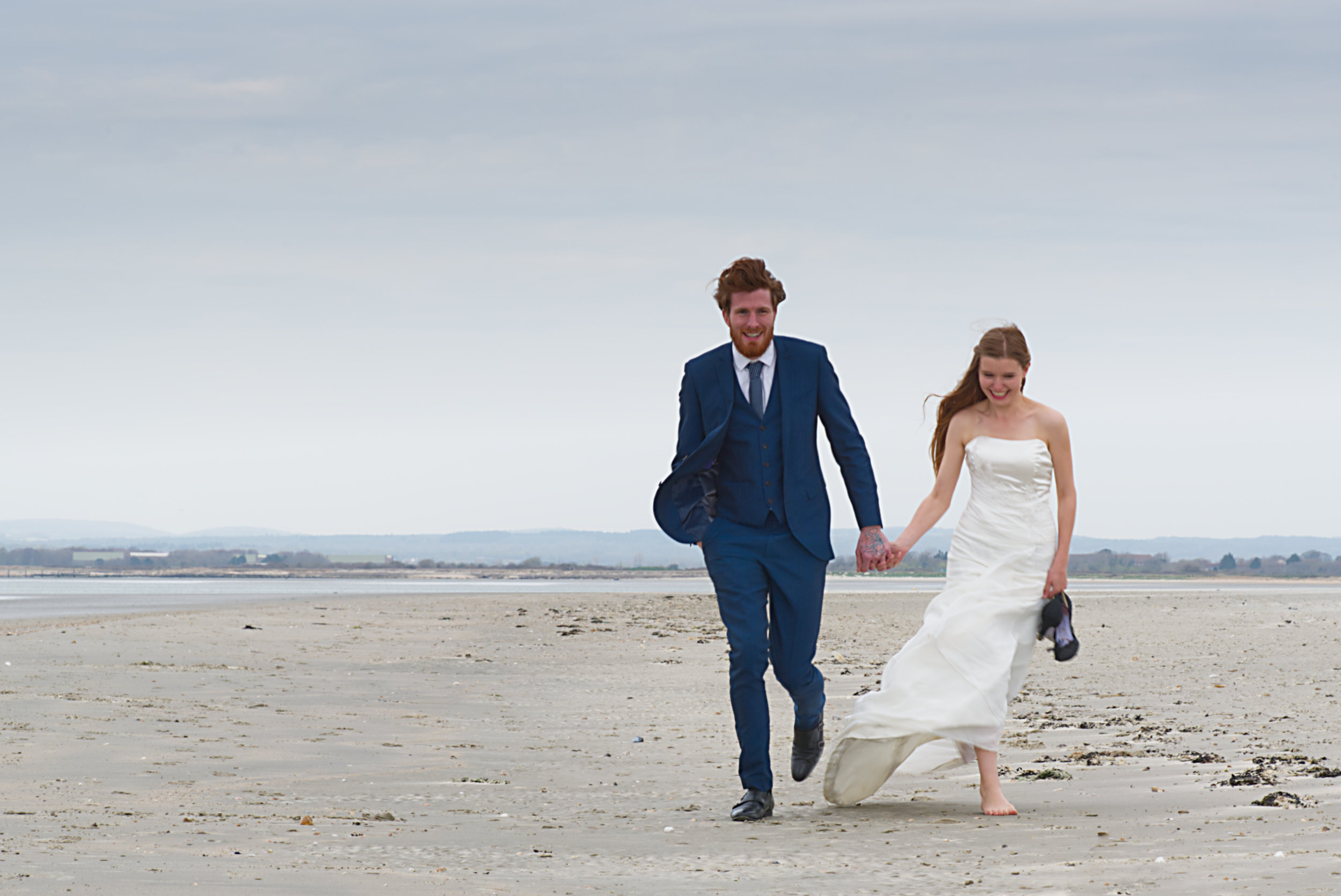 Logo elements ARROWS copyright Nadina Bee How to choose a date for your handfasting, UK Wedding photography of laughing wedding couple running on the beach