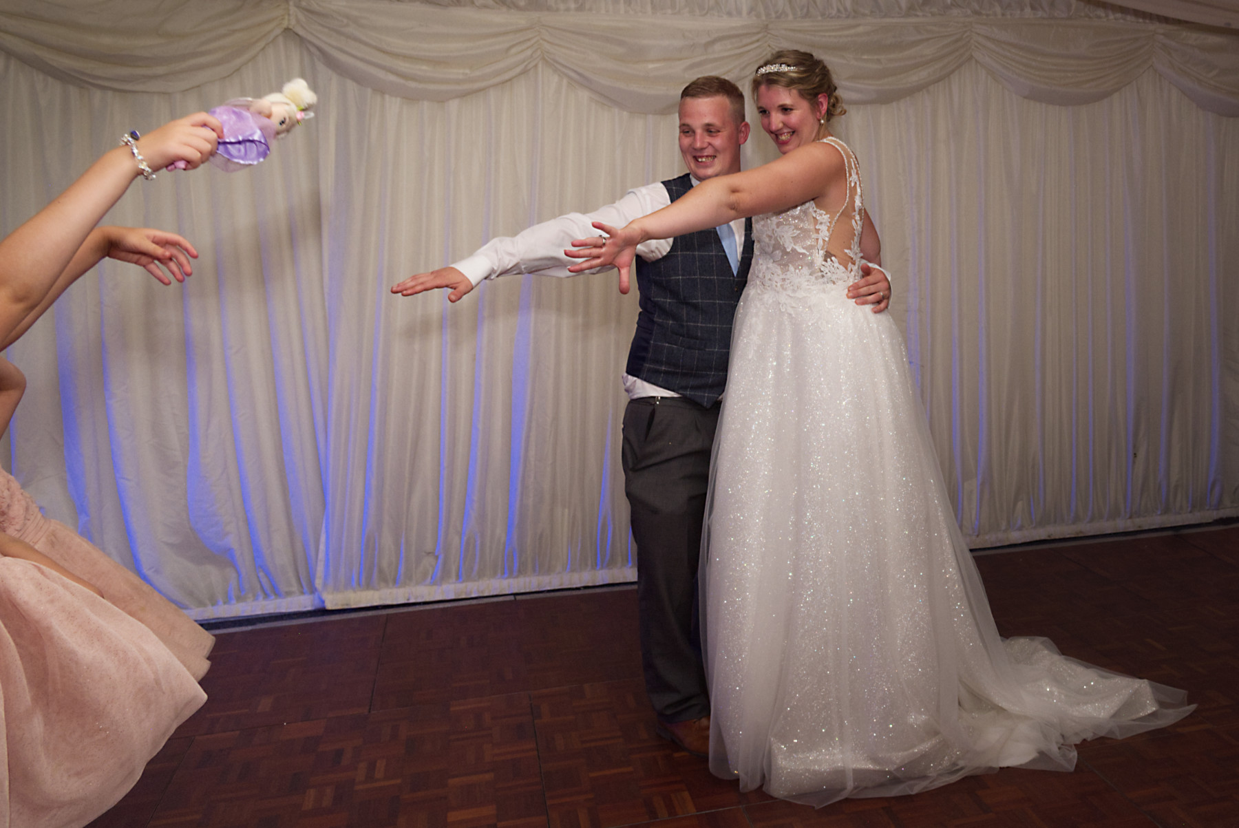 Bride and Groom asking children to join them on the dance floor after first dance at Mill House Reading Wedding Photographer Nadina Bee